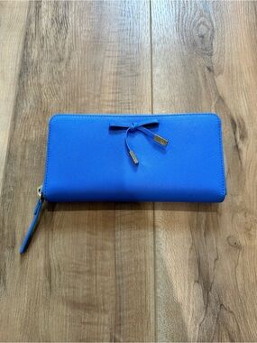 Kate Spade New York saffiano leather wallet vibrant blue bow embellishment